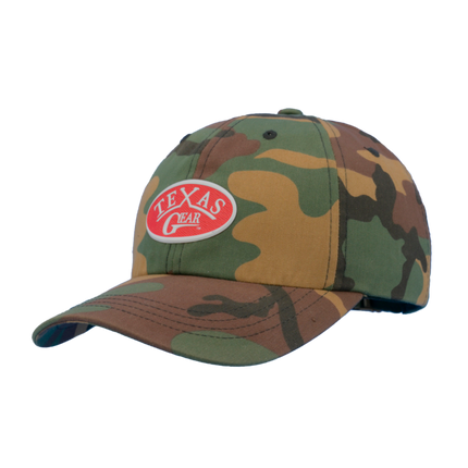 Texas Gear Emblem. Adorn the FlexFit YP Classic Retro “CAMO” Trucker Hat