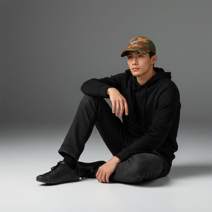 Texas Gear Insignia Logo. Adorn the FlexFit YP Classic Retro “CAMO” Trucker Hat