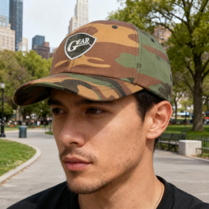 Texas Gear Insignia Logo. Adorn the FlexFit YP Classic Retro “CAMO” Trucker Hat